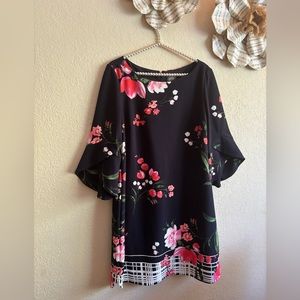 Beautiful floral dress with detailed sleeves.